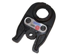 Sort Wavin Tigris presbakke Mini ACO102 til 32 mm rør, vist skråt forfra med rund åbning og metalmærke.