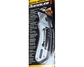 Stanley Quickslide arbejdskniv i blisterpakning med flersprogede instruktioner og bælteklips.