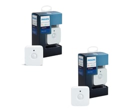 Philips Hue bevægelsessensorer i 2-pak, med en sensor vist uden for emballagen ved siden af den uåbnede pakke.