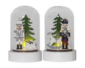 Star Trading nøddeknækker-borddekoration i 2-pak med figurer, juletræer og varmt lys under klare kupler.