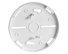 Schneider Electric afstandsring i hvid plast til lydgiver og blitz sokler, med prægede markeringer og monteringshuller.