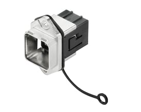 Weidmüller tomt hus til industrielle Ethernet-konnektorer, IP67, med sølvfarvet front, sort baghus og fastgjort låg, set skråt forfra.