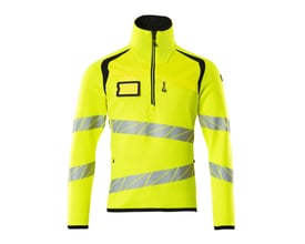 Mascot striktrøje med kort lynlås i Hi-Vis gul med sorte detaljer og reflekser. Høj krave og brystlomme er synlig. Størrelse L.