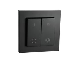 SG Connect switch front i sort finish med symboler for tænd/sluk og lysdæmpning, monteret på sort baggrund.