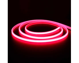 LEDlife Neon COB strip i rød farve, 10 meter lang, vist rullet op på mørk baggrund.