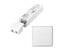 Lauritz Knudsen 60W/24V LED-driver og trådløst tryk til Fuga, sat sammen på hvid baggrund.