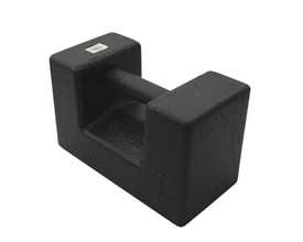 Diesella kalibreringslod på 20 kg i sort, blokform med integreret håndtag og præget '20kg' markering.