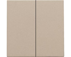 Niko smart 2-tryk tangent i champagne coating med en lodret sort stribe i midten, der adskiller de to trykflader.