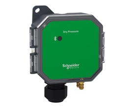 Schneider Electric SpaceLogic tryksensor til vægmontage med grøn front, der viser 'Dry Pressure' og Bluetooth-symbol.