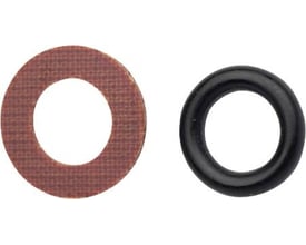 O-ringe med fiberskive fra IMI til radiatorventiler, vist som en sort ring ved siden af en brun fiberskive.