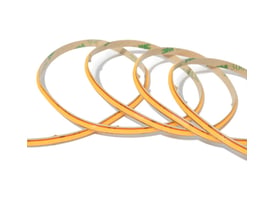 COB-LED-strip Anycut på 5 meter ligger i løse buer og viser den smalle, orangefarvede lysstribe.