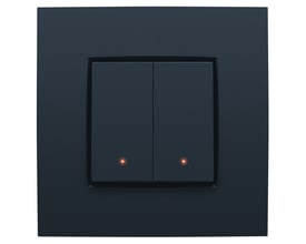 Niko 2-tryk med led og komfortsensorer i antracit, vist med to lysende røde indikatorlamper.