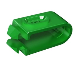 Lauritz Knudsen LexCom Home FixCable kabelholder i grøn plast med teksten 'Push' indgraveret. Produktet er isoleret på hvid baggrund.