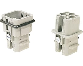 Nærbillede af Harting HAN D stikindsats med 7 hun-poler og detaljer om dens crimptilslutningsmekanisme.