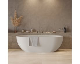 Frontalt billede af Ideavit Solidera badekar i hvid solid surface, der fremhæver dets fritstående design med overløb og diskrete detaljer.