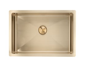 Lavabo Low håndvask i massiv messing med firkantet kumme og rund bundventil, set ovenfra.