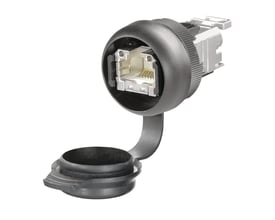 Detaljeret visning af Weidmüller FrontCom Micro indbygningsstik med CAT.6A RJ45-port og IDC-terminering, isoleret på hvid baggrund.