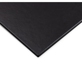 Tættere visning af Svedbergs sort bordplade med en let tekstureret overflade og slanke kanter.