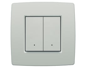 Niko 2-tryk i lys grå til Niko Home Control med integreret temperatur- og fugtighedssensor og LED-indikator på hvid baggrund.