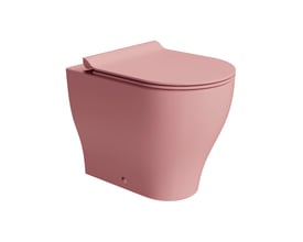 GSI Tono back-to-wall-toilet med geniusflush i mat lyserød, set skråt forfra med toiletsædet lukket.
