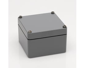 Bernstein CA-060 alu montagekasse, 58x64x36 mm, i sølvgrå med synlige fastgørelsesskruer i hjørnerne på en hvid baggrund.