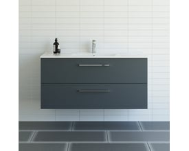Dansani Mido+ møbelpakke 121 cm i grå mat med 2 skuffer og Amber vask, vist mod hvidt flisepanel.