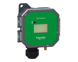 Schneider Electric SpaceLogic tryksensor med grønt frontpanel, LCD-display og synligt Schneider Electric logo på hvid baggrund.