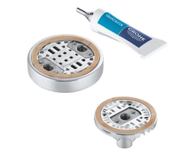 Grohe QuickGlue S1 limsæt til vægholdere, vist med en limtube og to forskellige monteringsskiver i krom med brunlig klæbepude.