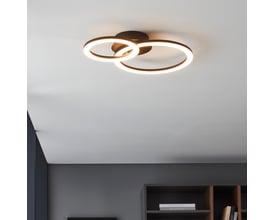 EGLO Parrapos-Z loftlampe monteret i moderne loft med to sammenflettede sorte ringe, der afgiver varmt lys.