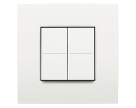 Niko lysdæmper til Hue-system med fire hvide knapper og sort ramme, monteret på en firkantet hvid plade.