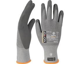 Bagside af OX-ON Flexible Advanced 1907 ESD-handske, der viser certificeringer og materialebeskrivelse trykt på stoffet.