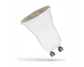 SpectrumLED mini GU10 LED-lyskilde på 2 W med linse, vist skråt med lysfladen og de to stifter synlige.