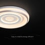 Den hvide V-TAC LED-loftlampe lyser varmt, set skråt nedefra med fokus på de koncentriske lysringe.