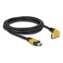 Delock HDMI-kabel i sort med gule stikdetaljer, rullet sammen med et lige og et 90° opadvinklet stik.