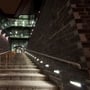 V-TAC LED-trappespots lyser langs en udendørs stentrappe og er monteret i væggen ved trinene.