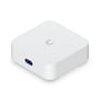 Ubiquiti UniFi Express 7 Wi-Fi-router set skråt oppefra med logo på toppen og skærm på fronten.