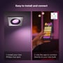 Dobbelt skærmvisning: til venstre et Philips Hue Centura spot med pink lys, til højre en hånd der bruger appen til at styre lyset.