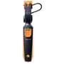 Testo 115i smart probe overfladeføler i brug, viser den tændte grønne LED-indikator og Testo logo.