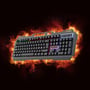 Deltaco DK130 gamingtastatur set skråt med farvet regnbuebelysning og flammemotiv i baggrunden.