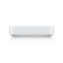 Ubiquiti Gateway Max, en kompakt hvid netværksgateway, set fra siden på sort baggrund.