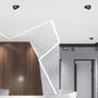 V-TAC 12W LED downlights installeret i et moderne kontormiljø med træ- og marmordetaljer i loftet.