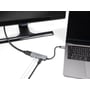 DeLock USB-C-adapter til HDMI med headset- og mikrofonport er tilsluttet en bærbar computer og en skærm.
