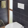 Villeroy & Boch Viconnect E300-betjeningsplade monteret på mørke fliser over et toilet i et badeværelse.
