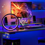 Slim Cirkel RGBIC lampe Ø20cm, placeret på et gaming-skrivebord med musiknotationer og oplyst baggrund.