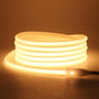 Tændt LEDlife Neon COB LED strip med 280 LED/meter, 4000K, der lyser med et neutralt hvidt skær på en mørk baggrund.