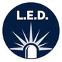Cirkulært ikon med teksten 'L.E.D.' og en illustration af en lysende LED-pære.