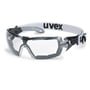 Uvex Pheos Guard sikkerhedsbrille med sort og gråt stel og en hvid rem med sort 'uvex' logo. Brillen har klare linser og er vist med fronten opad på en hvid baggrund.