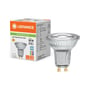 Ledvance PAR16 LED-reflektorpære ved siden af emballagen, hvor 6,1 W, 575 lm, 6500 K og GU10-sokkel fremgår.
