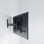 Vogel's TVM 3425 vægbeslag monteret på et moderne TV, vist fra siden på en hvid væg.
