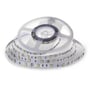V-TAC LED strip rullet ud fra en spole, viser tæt placerede LED'er og markeringer for 12V.